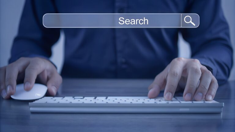person-using-computer-search-bar-research