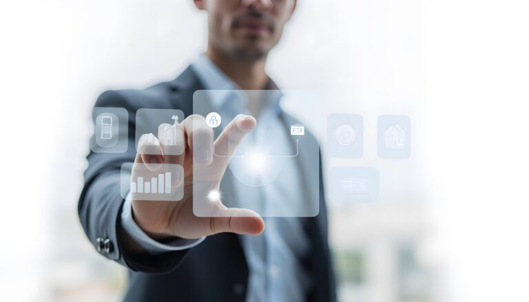 A businessman engages with a digital touchscreen in a sleek office, showcasing innovative technology that enhances communication and data visualization.